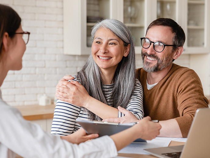 couple meeting with financial advisor to discuss successful retirement strategies